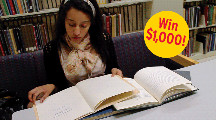 Person studying in the library with text: win $1,000!