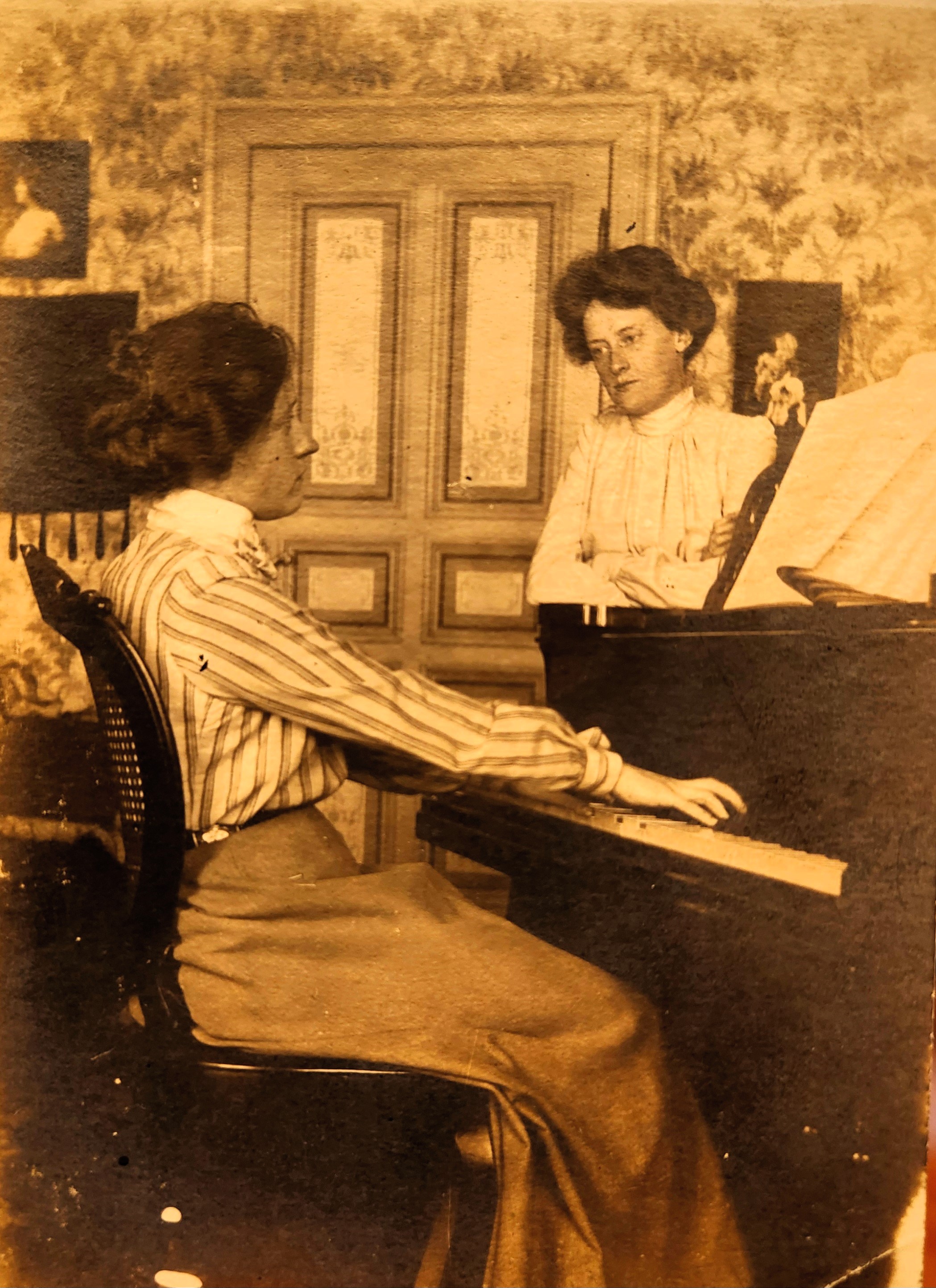 Photograph of Marguerite Melville at the piano. 