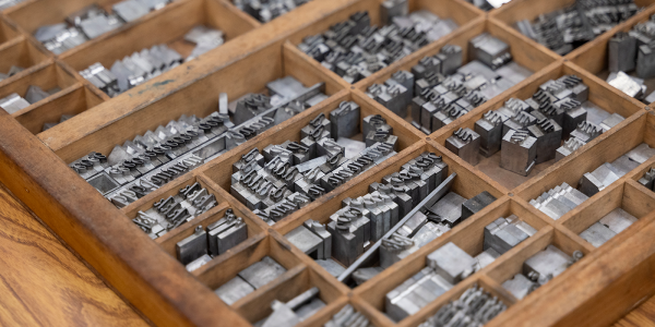Printing press letter pieces.