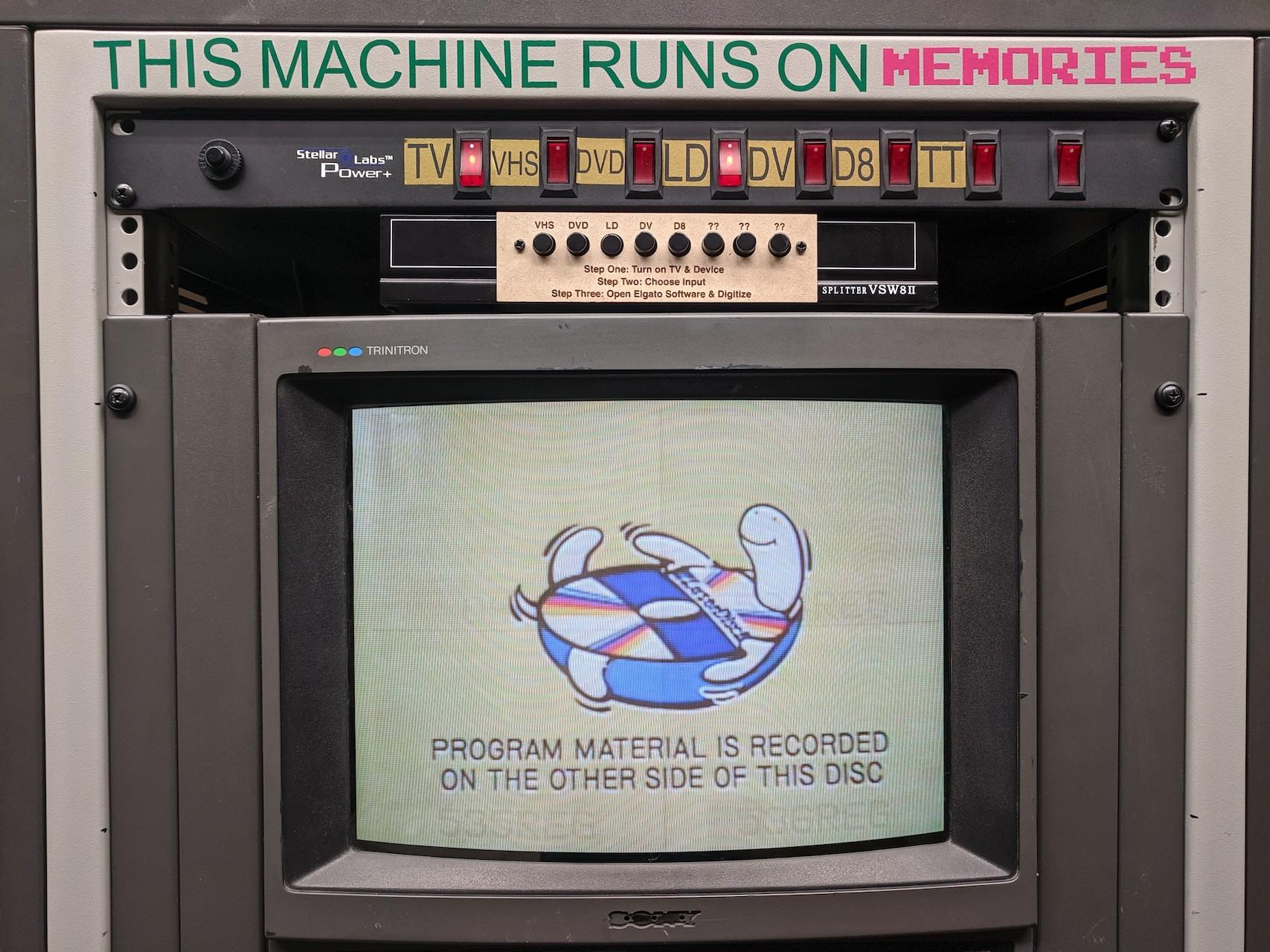 Old CRT TV screen displaying cute turtle with a media disc. The frame around the TV says, "This machine runs on memories"