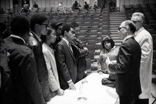 Black Student Union members speak with President Elkins in May 1969