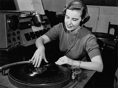 Woman adjusting record