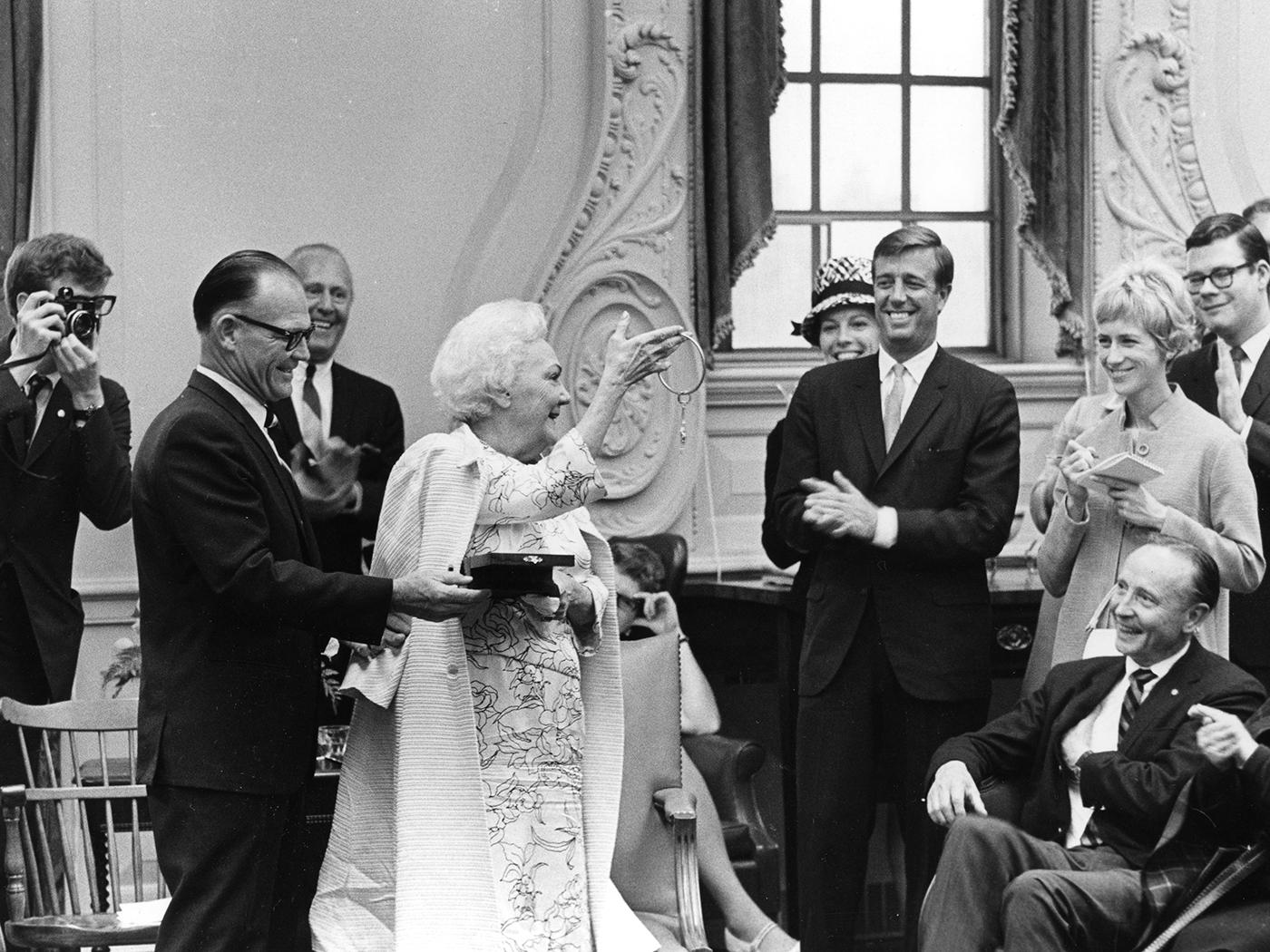 Katherine Anne Porter holding keys given by President Elkins