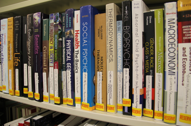 Textbooks on a shelf.