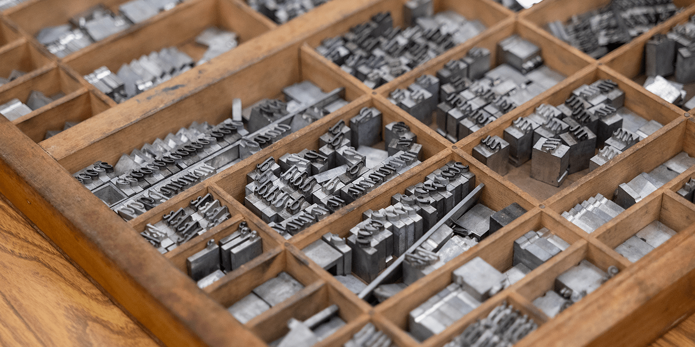 Printing press letter pieces.