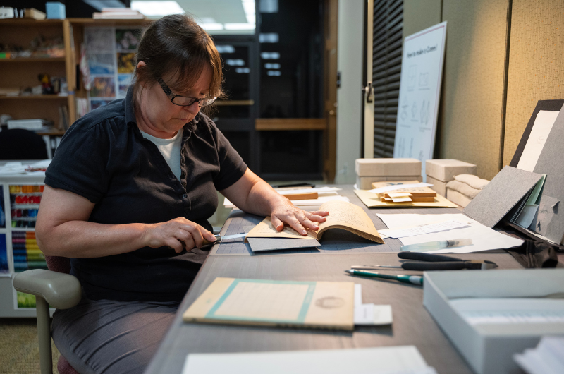 A person working with Prange Collection materials.