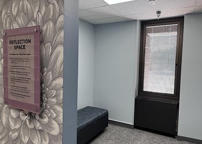 small area tucked behind floral patterned wall affixed with a usage guidelines plaque